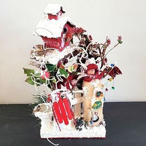 Handcrafted Christmas scene decor with snowman and birdhouse